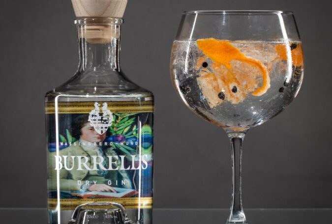 Bottle of Burrells gin from Massingberd Mundy with glass of gin and tonic